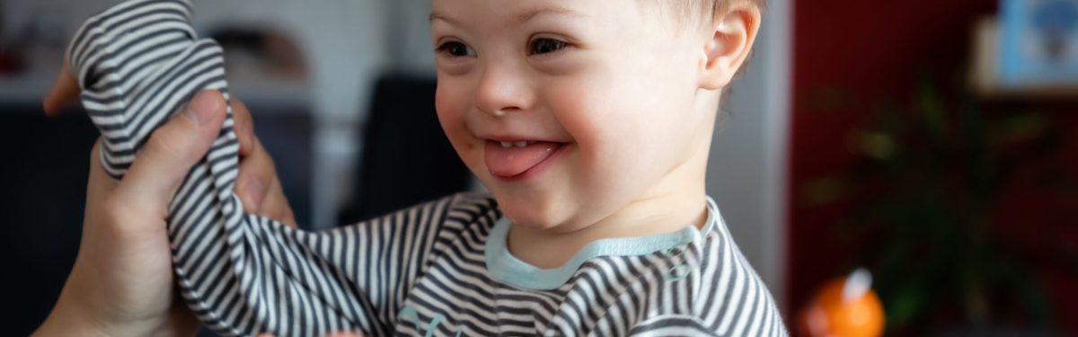 Cute,Boy,With,Down,Syndrome,Playing,With,Dad,On,In